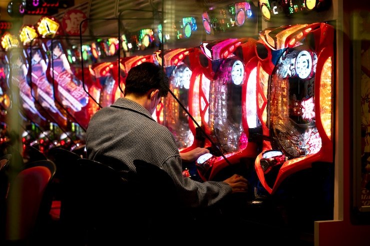 jatimtoto login platform dashboard showing slot games, live-dealer tables, and sportsbook markets across device screens